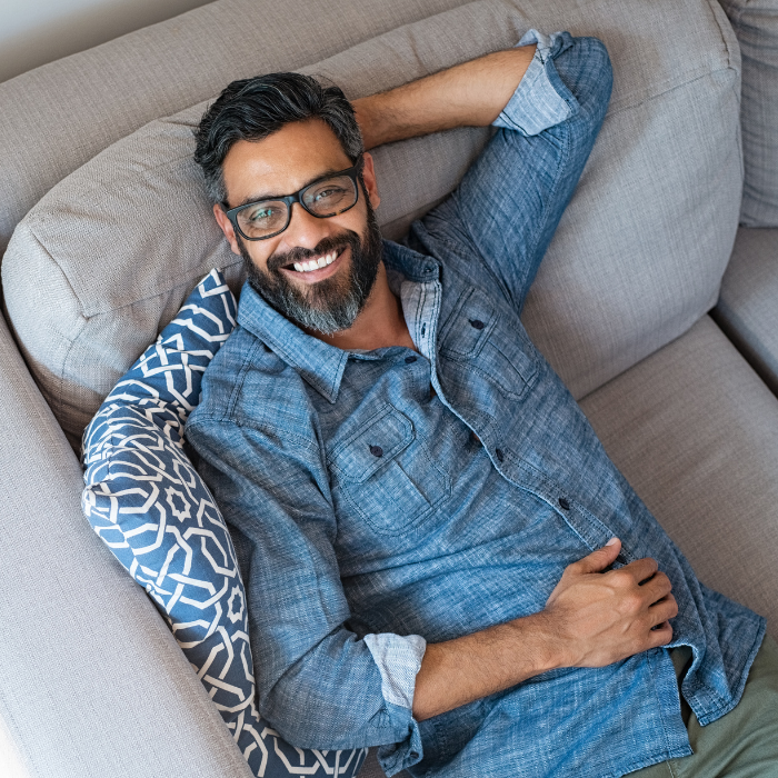 man relaxing on the couch